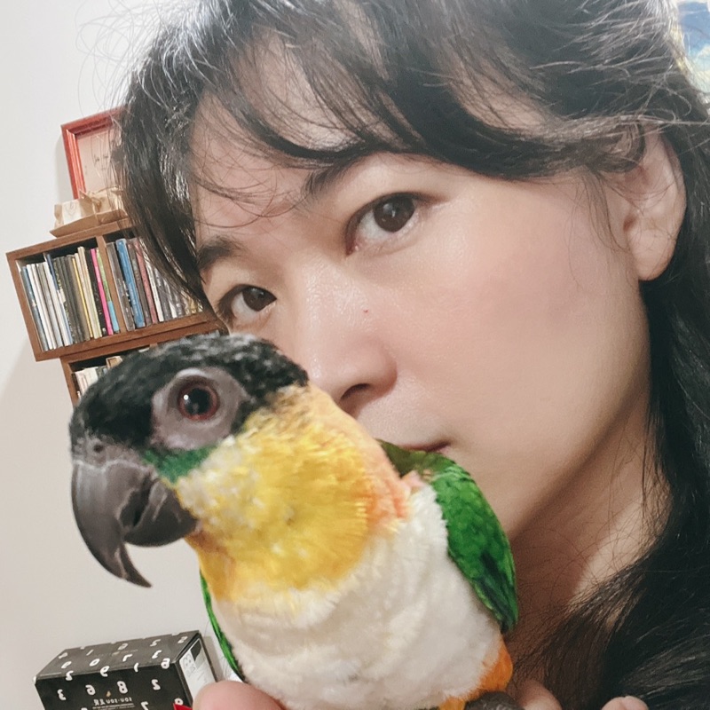 謝**