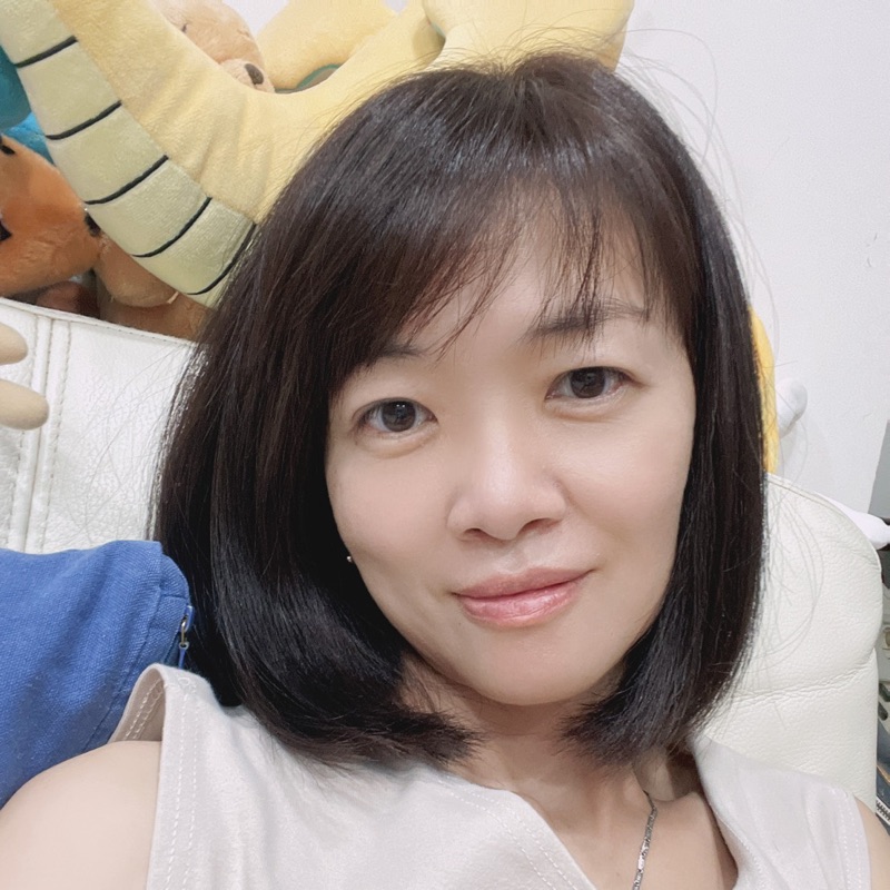 劉**