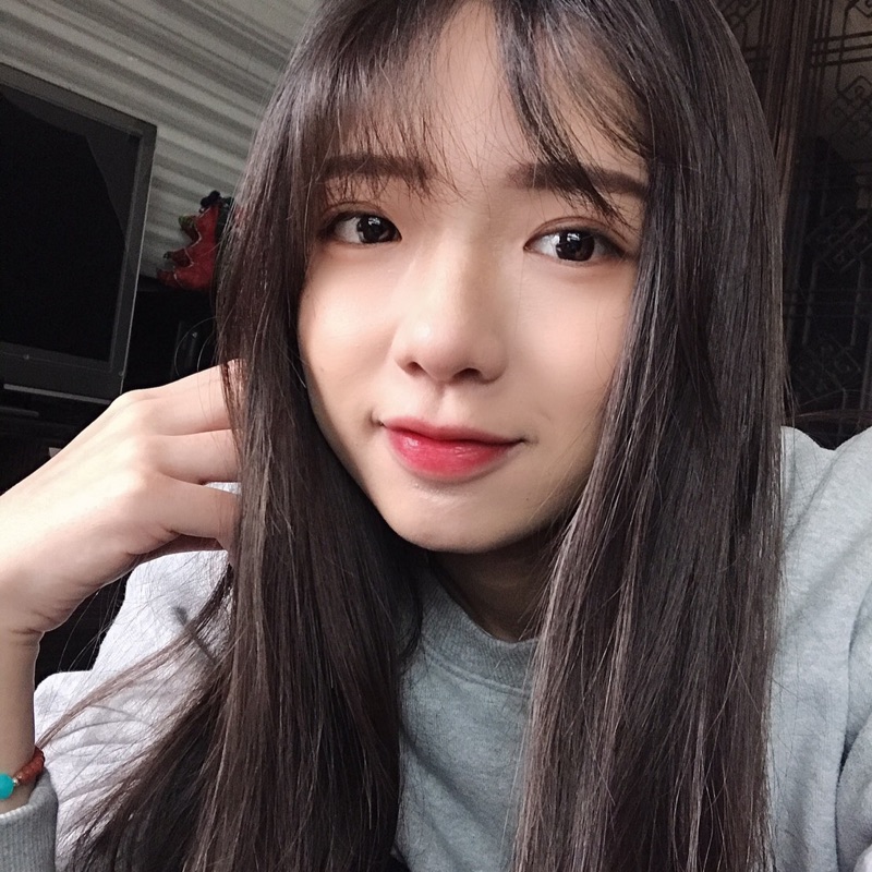 劉**